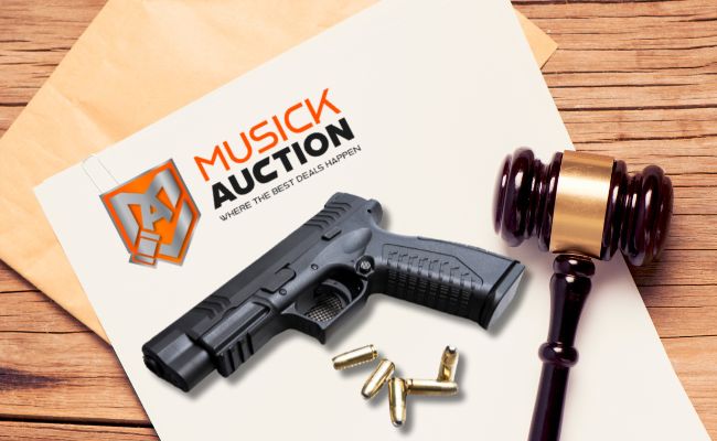 musick auction bid paper with firearm and ammo and auction gavel on top